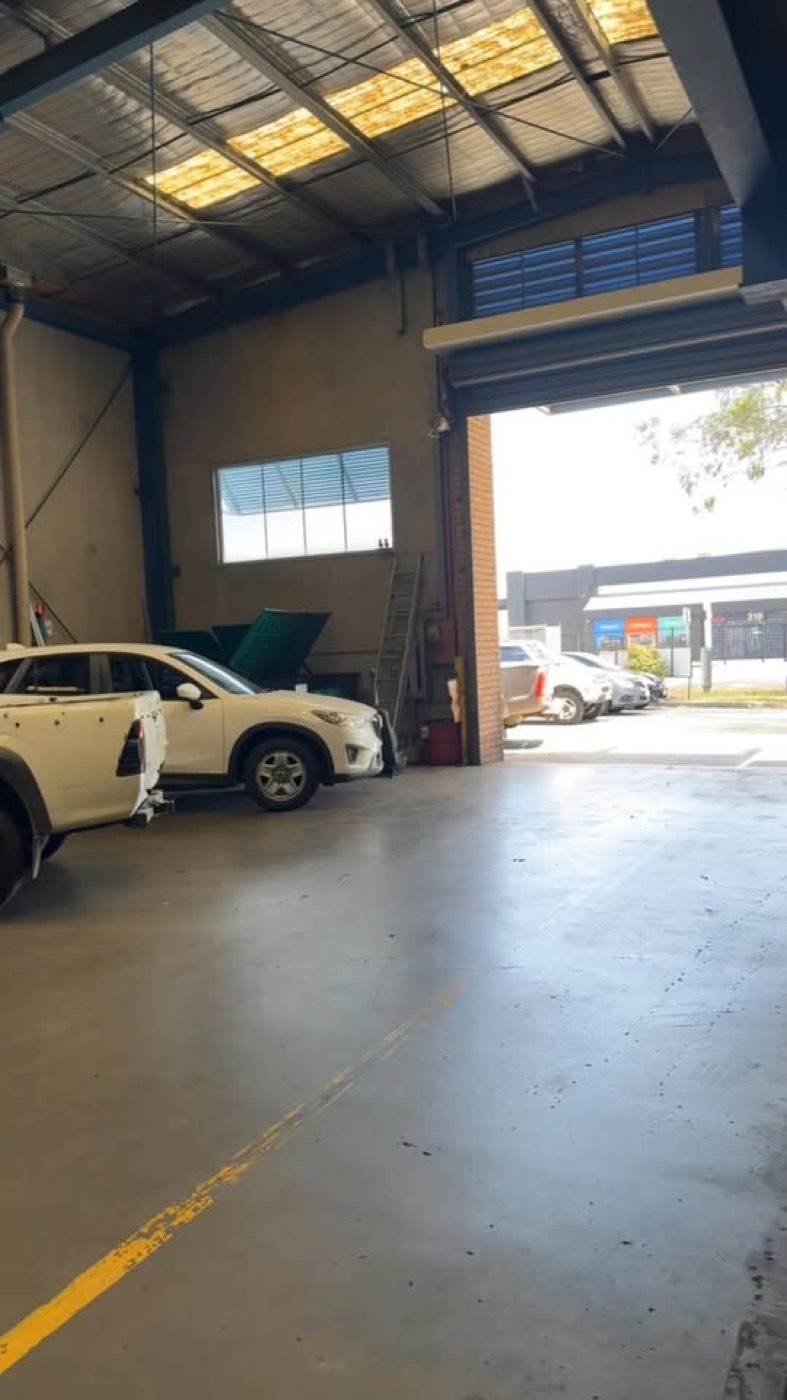 Car on the hoist inside the VS Auto Repairs workshop in Carrum Downs